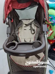  1 عرباية اطفال مع car seat (Graco)