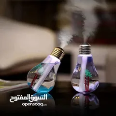  1 مبخره مائية نوعية ممتازه على شكل كلوب وبنفس الوقت ضوئية فقط تضيف ماء مع بخا وحدا ريحا وتشغلها