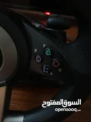  7 a pxn simulator pack with a steering wheel and a pedals with a gear shifter