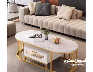  4 طاولة وسط مودرن فاخرة لغرفة معيشتك  سطح خشبي بتفصيل ماربل فاخر باللون الأبيض  مع عروق رمادية أنيقة