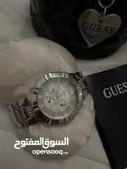  1 ساعه guess اصليه لون فضي