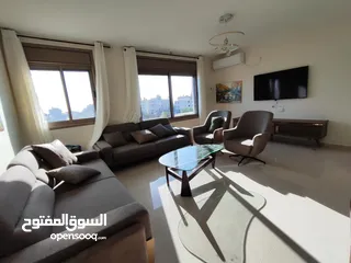  1 شقة بإطلالة عالية في قلب عين منجد – فرصة لا تعوّض