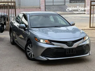  1 تويوتا كامري هايبرد ليثيوم امريكيه  موديل 2020 حره بحاله ممتازه وبسعر مغري للبيع
