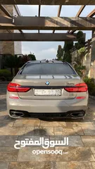  1 Bmw 740e M sport package 2017 أسمنتي مميز