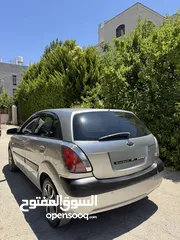  4 كيا برايد 2007 متور 1600 بنزين حساسات خلفيه تحكم ستيرنج تدفئة كراسي فحص نظيف