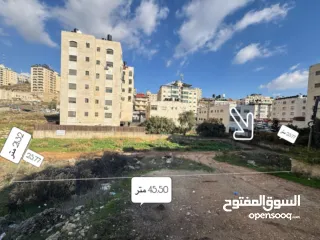  1 ارض للبيع في ام الشرايط بالقرب من الشارع الرئيسي