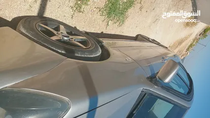  11 متسوبيشي لانسر لون شمباني موديل 2004