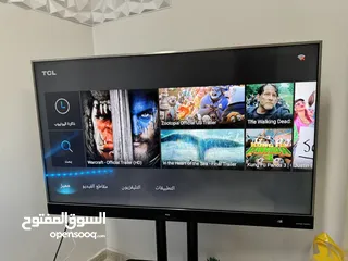  1 تلفزيون سمارت tcl 55 بوصة و ستاند زجاجي