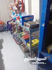  6 اثاث بقاله واجهه المنيوم وباب حديد سحاب