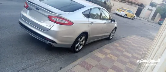  20 فورد فيوجن 2014 هايبرد كلين فحص كامل لون سلفر بحالة الوكالة
