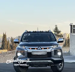  2 ميتسوبيشي L200 2023 لون فيراني مميزه فحص كامل كرت ابيض 7 جيد وارد الشركه