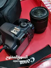  1 كاميرا كانون D1200