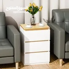  9 خزانة بيضاء جانبية أنيقة بلمسة خشبية عصرية  الاناقة والبساطة في تصميم واحد  ادراج عملية لحفظ اغراضك