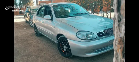  4 سيارة دايو لانوس موضيل 2002 موتور 1600 السيارة لعبة بالنايلون منفولة جديد مش ناقصها غير الصلاة ع نبي