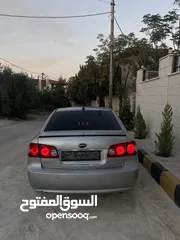  13 كيا لوتزي 2006 3 جيد لون سلفر ماتور 2000cc