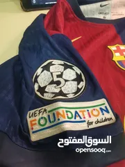  2 تيشيرت برشلونة نسخة لاعبين  كوبي ون مع شعار دوري الابطال موسم24/25