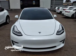  1 تيسلا 2021 ستاندرد بلس فحص كامل 4 جيد في المنطقة الحرة وارد امريكي داخلي ابيض
