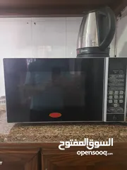  8 خزانة مونة وطاولة شاشة ومايكرويف وخزانة اخدية