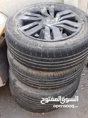  1 honda engine cover and 4 tyre with rim