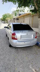  1 هونداي فيرنا 2006 مع كامل الإضافات  (شاشة لمس، كاميرا خلفية، شبابيك كهربا...)