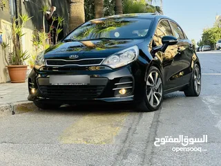  1 كيا ريو 2016 فل مع فتحه مميزه لون اسود نادر ومميز بالنضافه