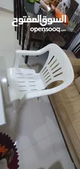  4 Plastic white table with chairs