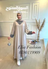 1 فستان مقلم او عباي سعرها 12
