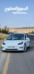  1 Tesla Model 3 Standerd Plus 2022 ابيض وداخليه ابيض جمرك جديد شهر 12‎ بسعر 20 الف بدون الرقم