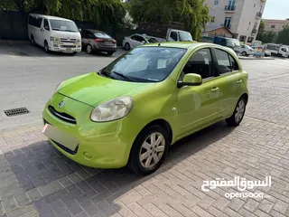  4 Green color Nissan Micra 2012