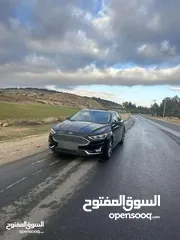  14 سيارة فورد فيوجن 2014 تيتانيوم لون اسود معدله 2020 سبعه جيد للبيع بسعر مغري