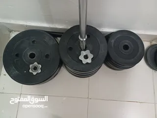  4 50 kg weight training plates, barbell and lock