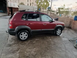  3 جيب هونداي توسان موديل 2007 ماطور 2000 لون خمري كام لا ينقصه شيئ