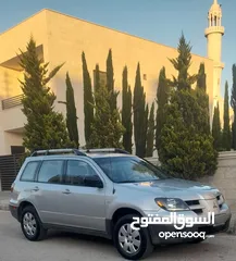  13 متسوبيشي اوتلاندر 2003 بحالة الشرگه