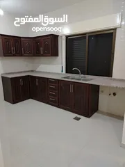  1 شقه فارغه للايجار جديده لم تسكن  ابونصير خلف مبنى امانه عمان