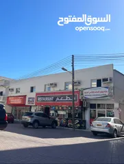  2 مبنى تجاري للبيع صلاله على شارع النهضه