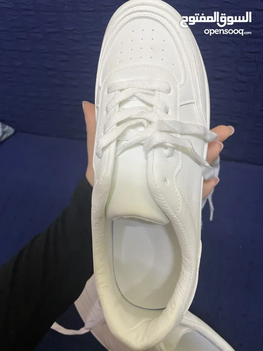 white brand new shoes (not used at all)  sized 42 with white shoe laces