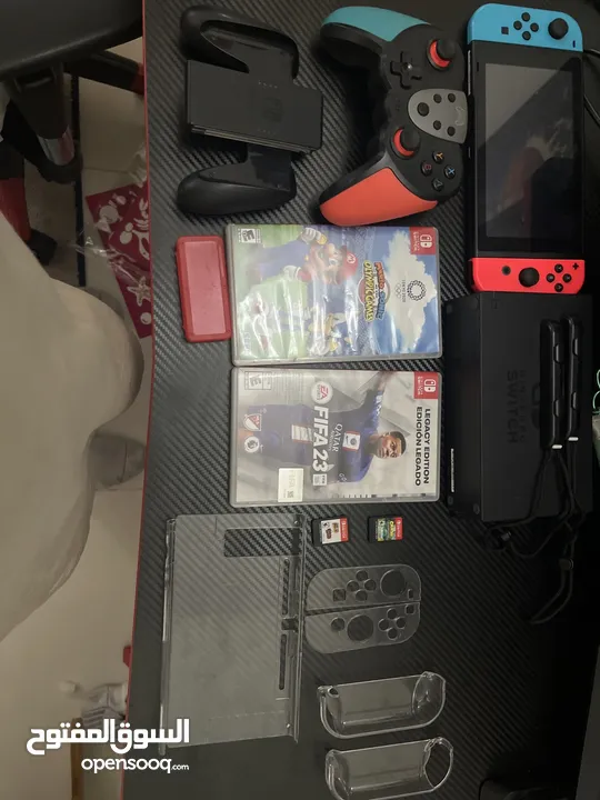 Nintendo switch with accessories and games