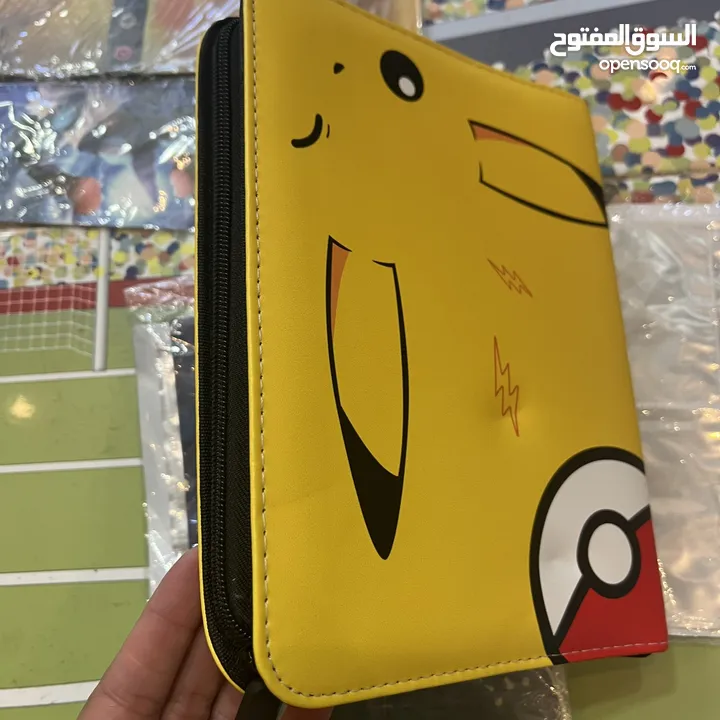 كروت بوكيمون والبومات (Pokemon cards and binders)