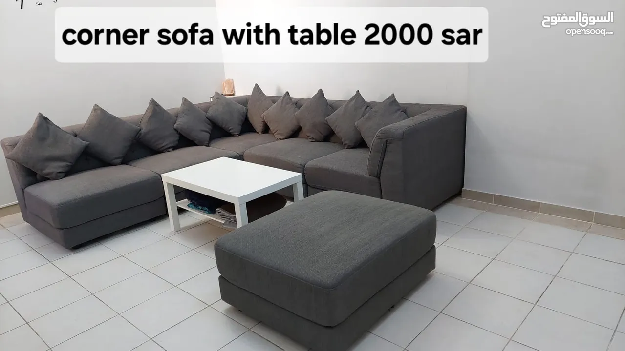 Corner sofa with centre table