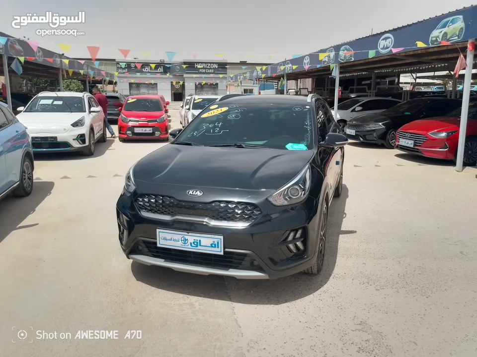 كيا نيرو هايبرد 2021 فحص 7جيد لون اسود مميزه للبيع مجمرك أو بدون جمرك للإعفاءات من المستورد مباشره