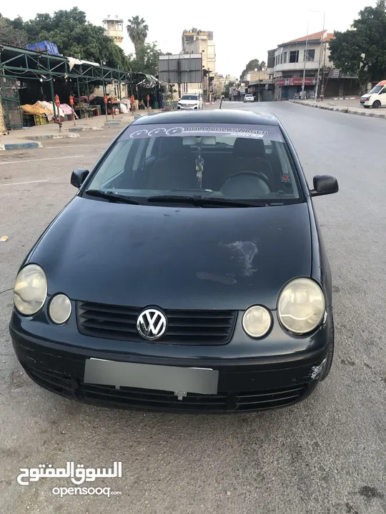 polo 2003  اللون الزيتي