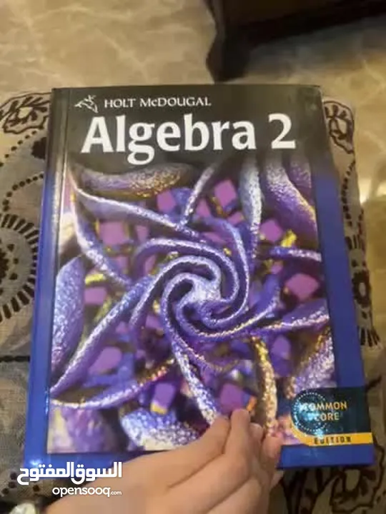 Barely used algebra 2 book, by Holt mcDougal ,common core edition.orginal price 110jd