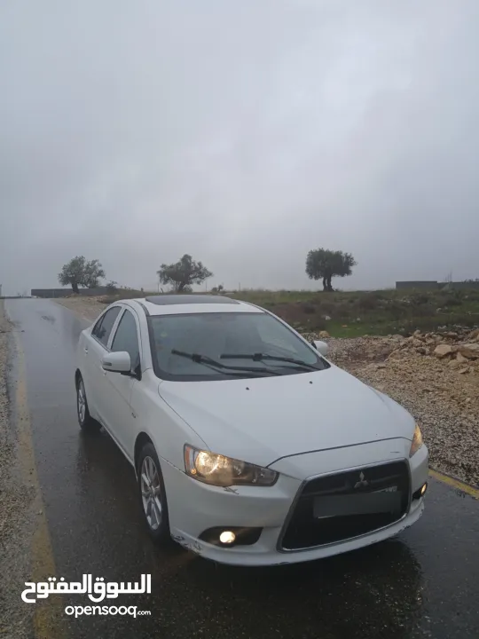 ميتسوبيشي لانسر. 2015 اصل برايفت   رخصة وتامين  ماطور 1600 اتومات  شامل  فتحة   اماكنية لبيع نص بنص