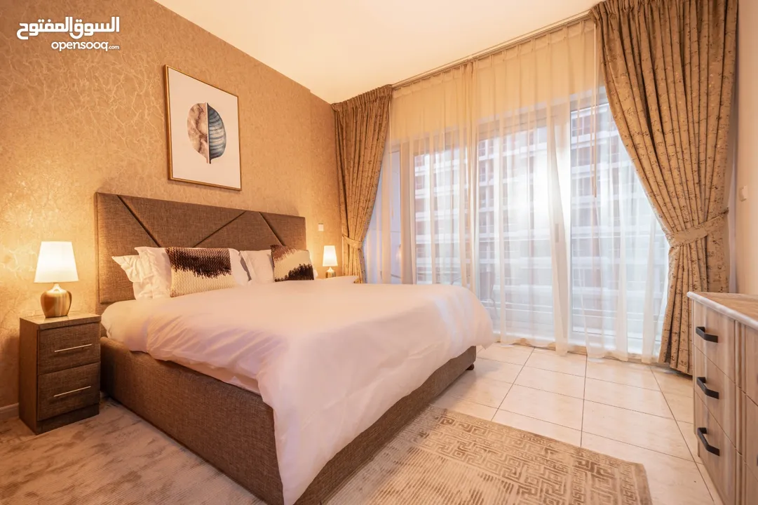 دبي لاند SKYCOURT  غرفة وصالة  مفروشة  سوبرلوكس مع بلكونه-إيجار شهري شامل