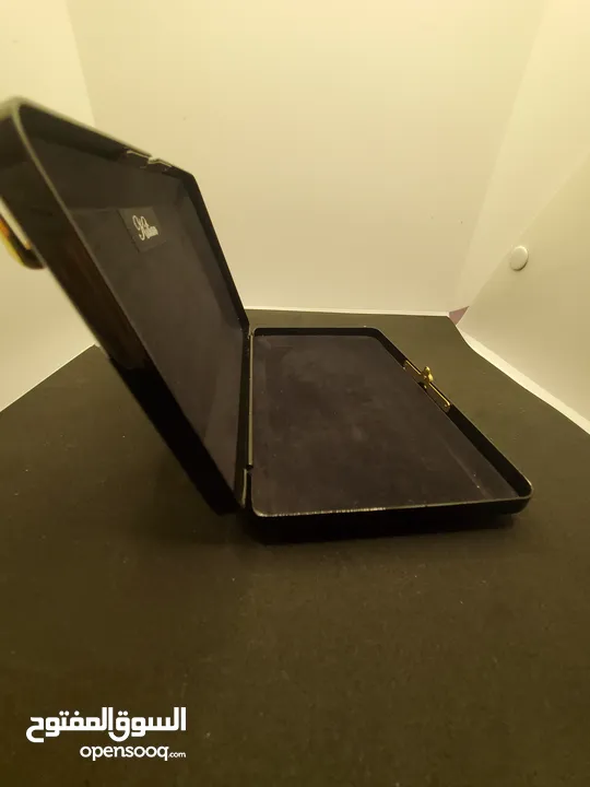 حقيبة كلاتش ذا تمبتريس من ماركة كيليان سوداء وراقيه ،Black Clutch The Temptress by Kilian
