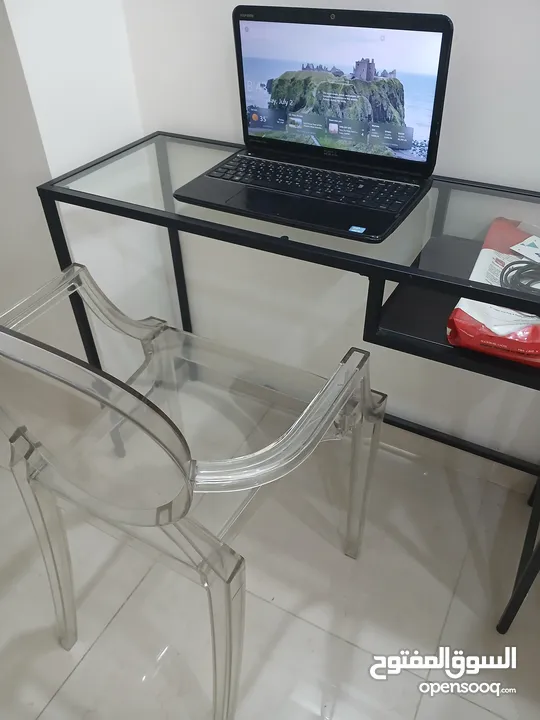 Elegant classy table for corners or entrance. Forge with glass surface table with plastic chair