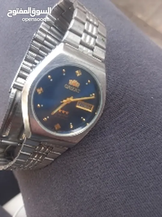 ساعة اورينت عقارب فضي اللون لون المينا زرقاء