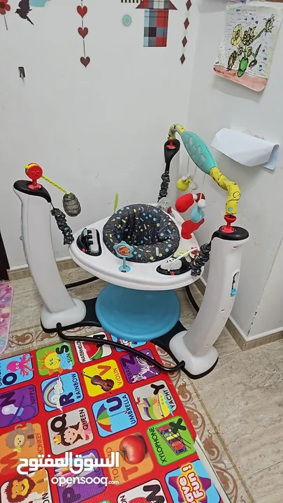 ExerSaucer Jam Session Jumping Activity Center - نطاطة اطفال الصغار