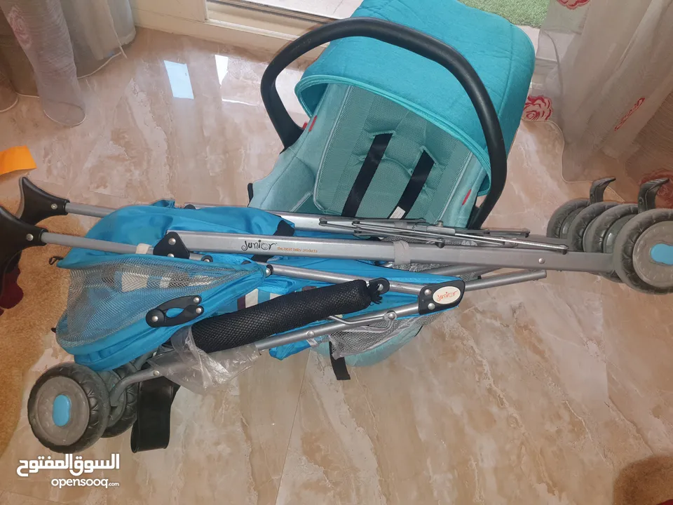 للبيع عربه خفيفه الوزن قابله للطي ماركه جونيور+كرسي طعام