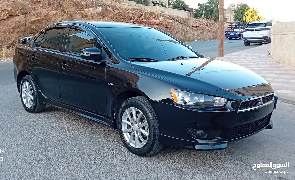 متسوبيشي لانسر فراشة موديل 2015 فحص مرفق مع الصور بحالة الوكاااااالة  ماشية 49 الف km  أصلي